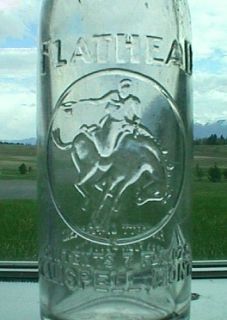 An 8 tall crown top soda bottle from KALISPELL MONTANA. Bottle has