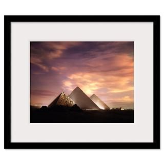 The Pyramids at Giza illuminated at dusk Framed Print
