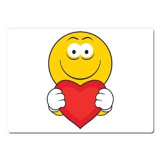 Smiley Face Holding Heart Mousepad by dagerdesigns