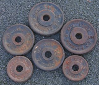 18 pounds of vintage Dan Lurie weight plates 2 each of 5 , 2.5 , and