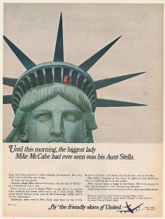 1966 Mike McCabe on Top of Statue of Liberty United Airlines Print Ad