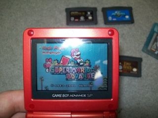 Red Nintendo Game Boy Advance SP with 7 Games 8 Game Cases and Charger