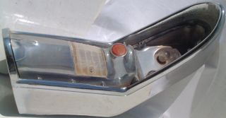 This is an original passenger side taillight housing for a 1956