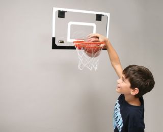 The SKLZ Pro Mini Hoop System attaches easily over your door or on the